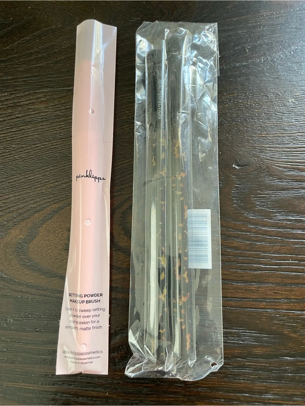 ipsy Pink Tie-Dye and Croc Texture Makeup Pouches with a variety of makeup